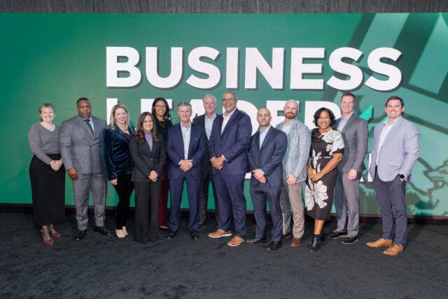 P. David Bramble receiving the 2025 Business Leader of the Year award, with MCB team members standing around him in support at Loyola University Maryland’s event.